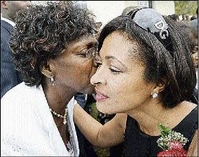 Lorna Golding (left), wife of the prime minister, gives Neadene Tufton a hug and kiss at Wednesday&#39;s service of thanksgiving for Ruby Spencer-Blake, ... - Layout1_1_P7CWPlakeFuneAM